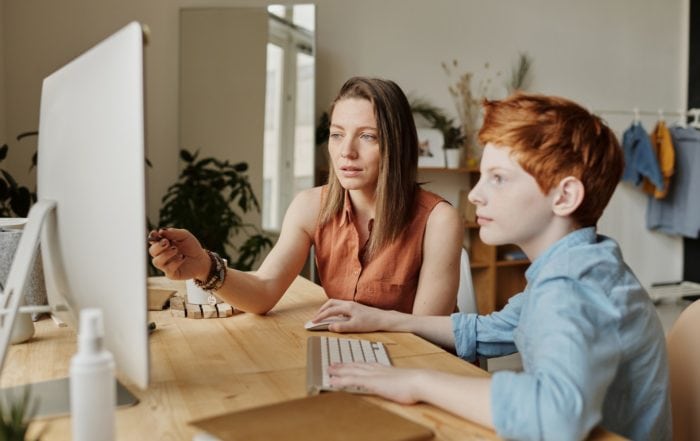 child and mom watching youtube