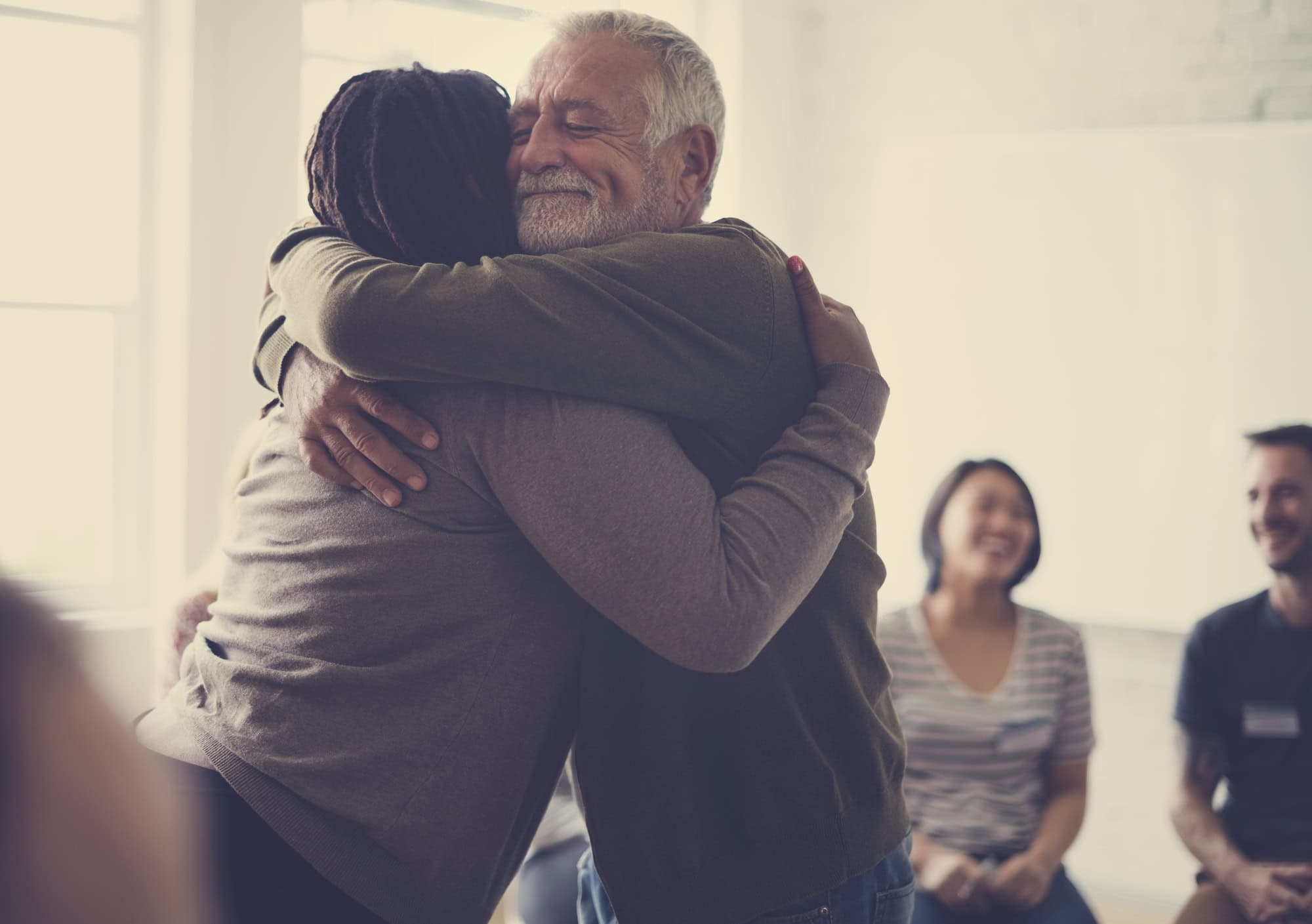 man hugging at contigency management group