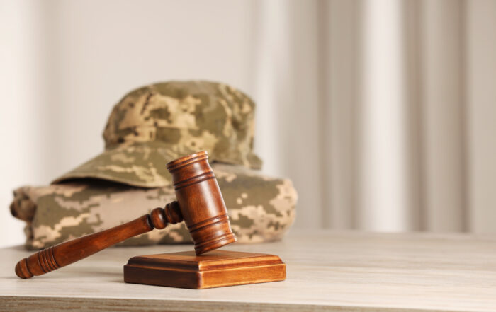 Gavel and military uniform representing veterans treatment court.