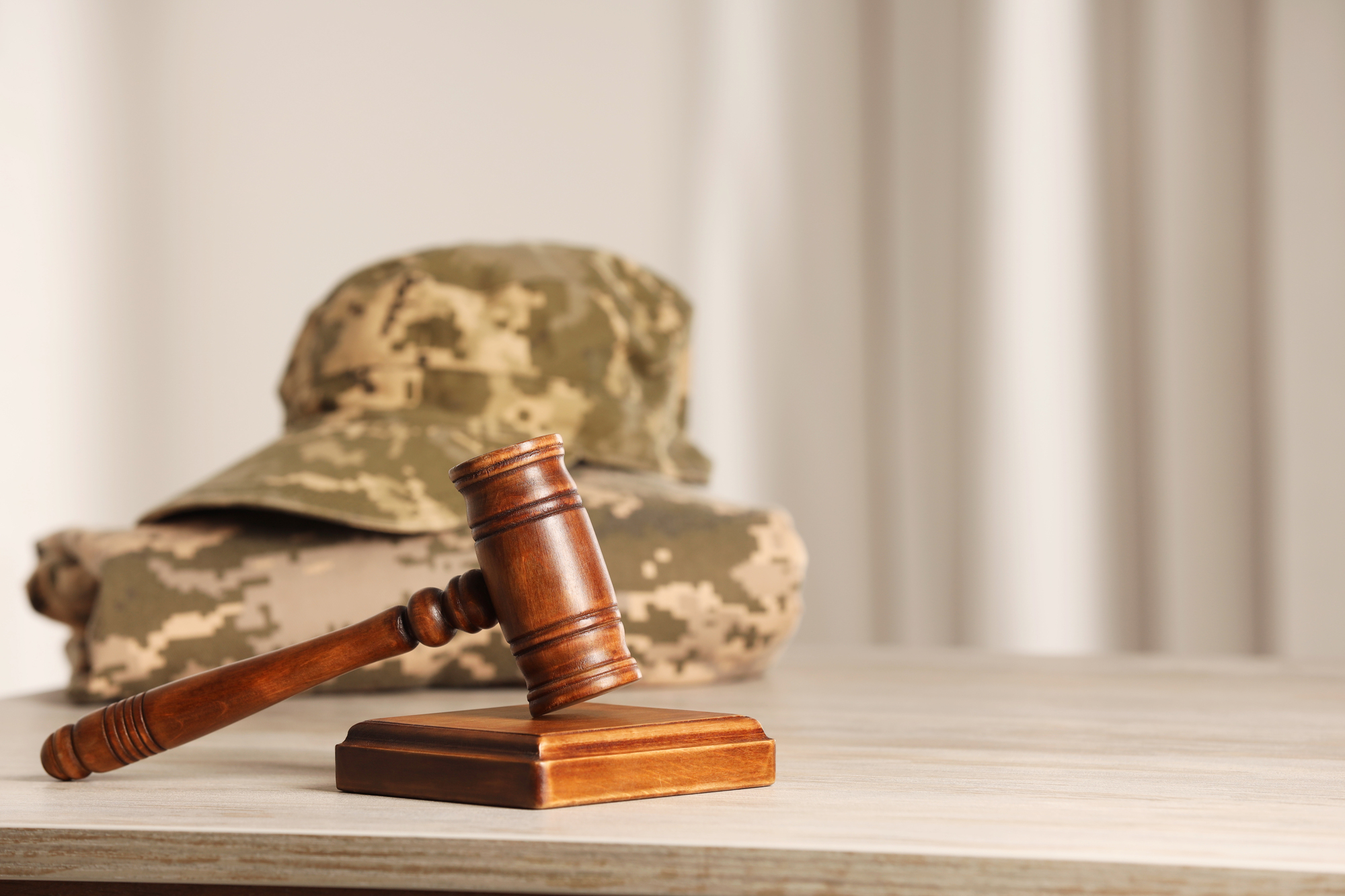 Gavel and military uniform representing veterans treatment court.