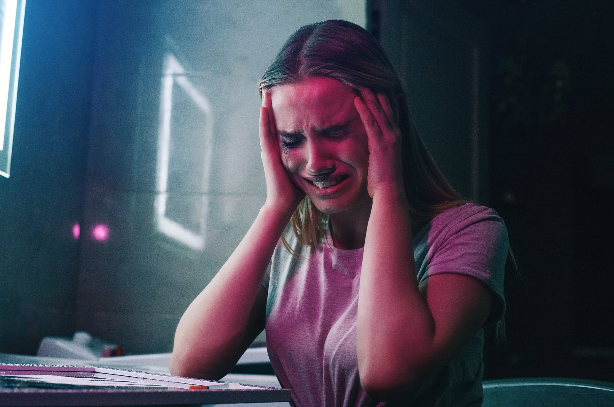 woman unhappy on pink cocaine