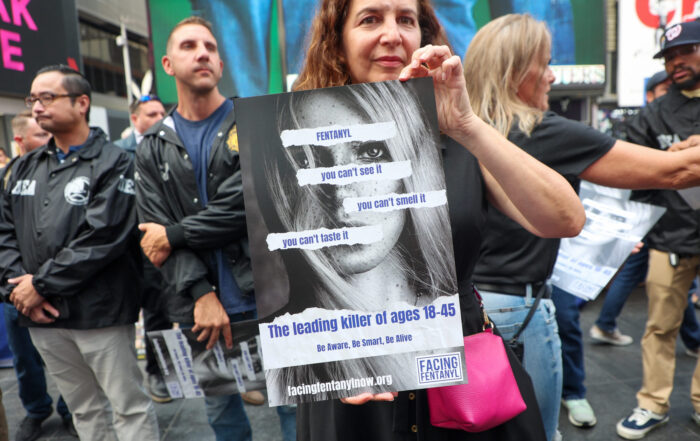 Woman with fentanyl poster